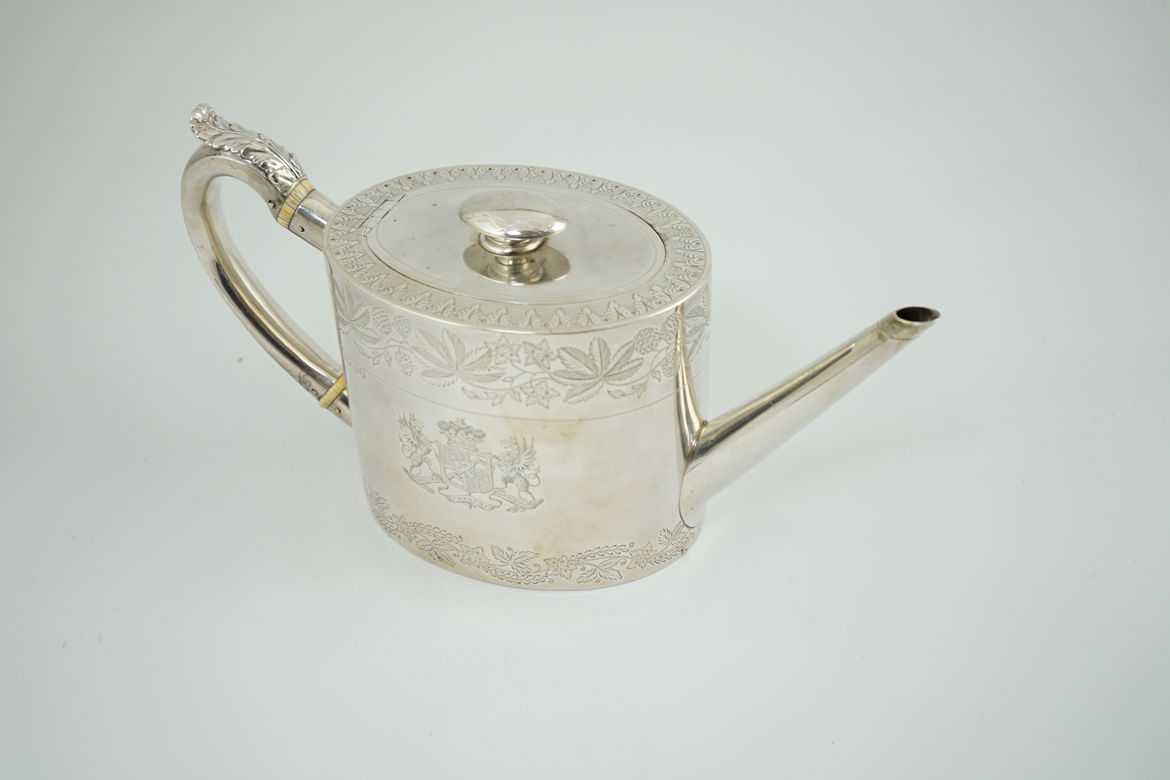 A George IV silver oval teapot by Eames & Barnard, engraved with Coat of Arms of the Duke of Bedford and Earl Compton